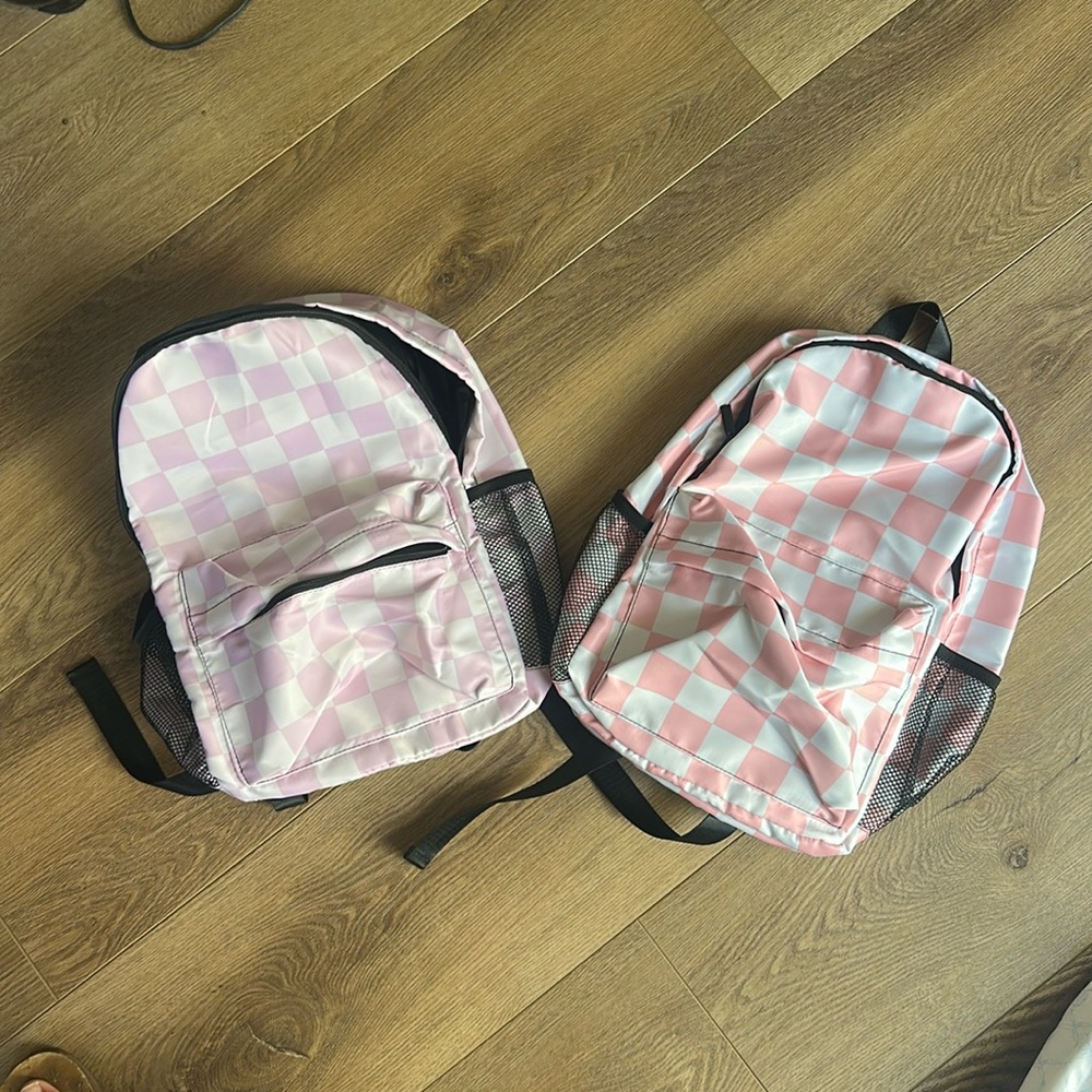 Pink/white checkerboard backpack, size medium. Perfect for Elementary.